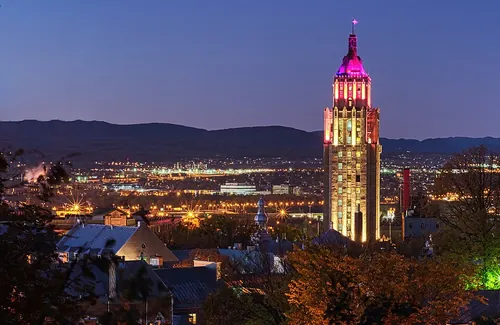 The Price Building illuminated at night in Quebec City.
